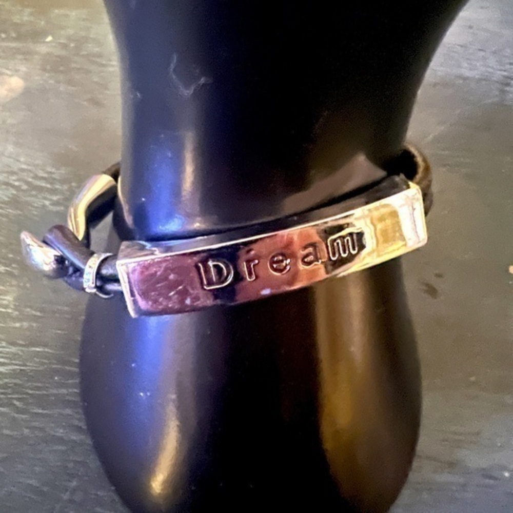 DREAM bracelet, silver tone with black double cord band & silver tone clasp.NWOT